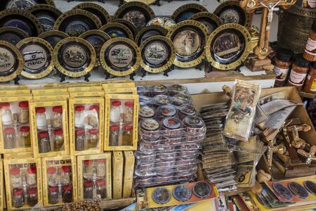 various souvenirs from the Holy Land lying on a stall in Nazareth, Israelの写真素材