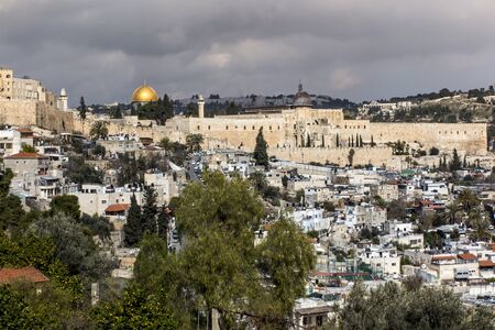 dense buildings in one of the Jerusalem areas in Israel as a backdrop