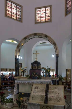 Mount of Beatitudes. Israel. January 27, 2020: Interior of the church on the Mount of Beatitudes in Israel, on the Sea of Galilee, Visible content of the blessings on stained glass and in the Bible.のeditorial素材