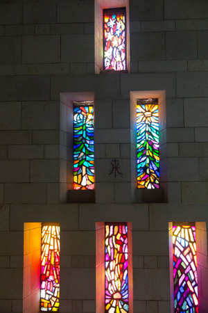 Nazareth, Israel, January 25, 2020: Basilica of the Annunciation - colorful stained glass windows seen from the inside of the basilicaのeditorial素材
