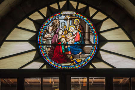 Bethlehem, Palestine. January 28, 2020: Interior of the Church of St. Catherine, stained glass window