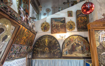 Bethlehem, Palestine - January 28, 2020: Fragment of the renovated interior of the Basilica of the Nativity in Bethlehem. Icons on the walls.のeditorial素材
