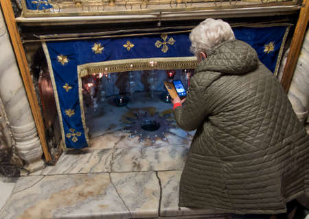 Bethlehem, Palestine - January 28, 2020: A silver star marks the traditional site of the birth of...