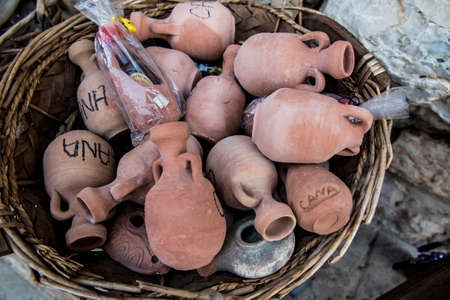 small clay pots, souvenirs from Cana Galilee in Israel, from the place of the miracle of turning water into wine by Jesus at a weddingの写真素材