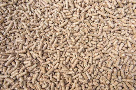 Wooden pellets used as fuel in ecological heating boilers. Close-up as a background.