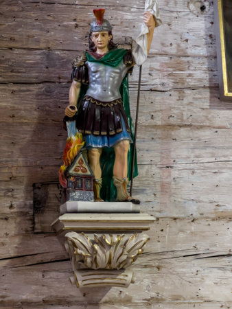 Ksiezy Las, Poland, July 1, 2023:  The  old (1494) wooden church of St. Michael the Archangel in Ksiezy Las in Silesia. Interior. Detail of the figure of St. Florian.のeditorial素材
