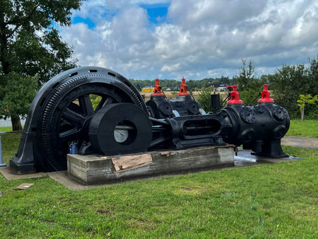 Tarnowskie Gory, Poland, August 7, 2023: An exhibition of old steam engines on the square next to the historic silver mine in Tarnowskie GÃ³ry. Steam winding machine, drum.のeditorial素材