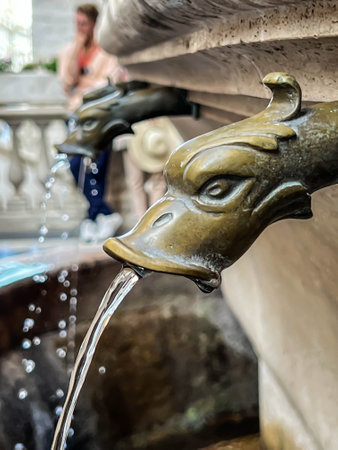 Decorative water outlets from the fountain at St. Peter's Basilica are a source of drinking water.の写真素材