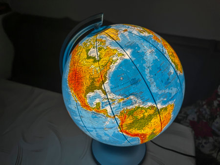 An illuminated globe as an educational gift for children, arousing curiosity about the world.の写真素材