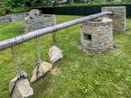 The millstone, olive oil press squeeze out olive oil. Presented at the Biblical Garden in Muszyna,...