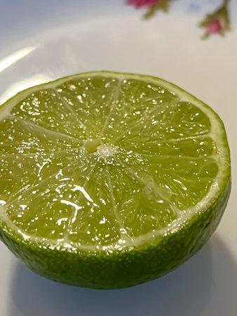 Close-up of a cut lemon lying on the table.の写真素材