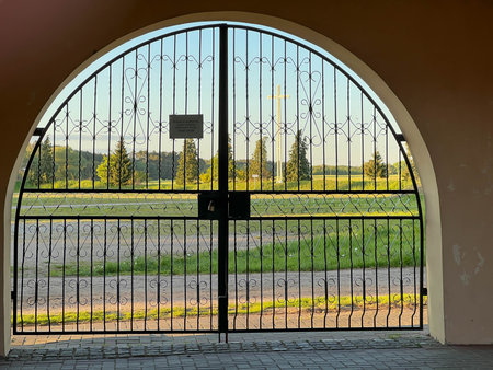 One of the gates to the garden at the Minor Basilica of Our Lady of Patiently Listening in Rokitno,...