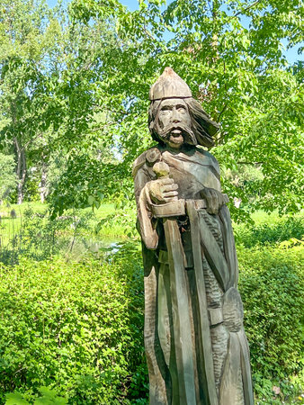 Historical figures made of wood placed in the park around the old castle in the park in Miedzyrzecz in western Poland.の写真素材