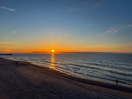 Sunset on the beach in May on the Baltic Sea in the Mrzezyno region in Poland.の写真素材