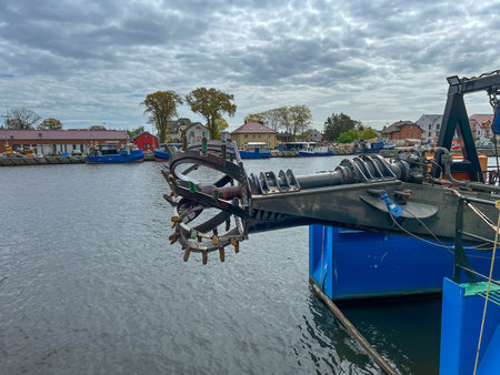 The working arm of a water basin dredger moored at the port of Mrzezyno, Poland.の写真素材