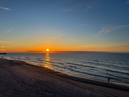 Sunset on the beach in May on the Baltic Sea in the Mrzezyno region in Poland.の写真素材