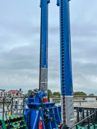 A machine used to remove sand and dredge the bottom of the fishing port in Mrzezyno, on the Baltic...