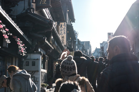 CHIBA, JAPAN - JANUARY 19 2019: Narita Hot Spot, Tourists at Naritasan Omotesando Road, a popular spot near Narita Airport, A retro cityscape, rows of Traditional Japanese-style houses, to Naritasan Shinshoji Templeのeditorial素材