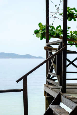 Close up, old wooden house by the sea, wood structure, blurred sea and  sky background.の写真素材