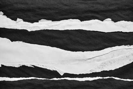 Black and White Torn Paper Collage Style, Ripped Paper Effect, Texture Abstract Background, Copy Space for Text.の写真素材