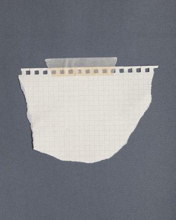 Torn graph paper with adhesive tape, scraps of paper on sticky tape, gray background.の写真素材