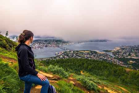 July 31, 2015: Traveller at the top of mount Storsteinen in Tromso , Norwayのeditorial素材