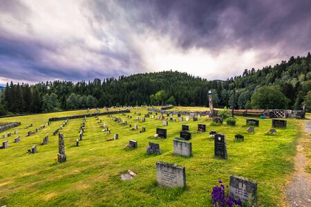 July 18, 2015: Graveyard of Eidsborg Stave Church, Norwayのeditorial素材