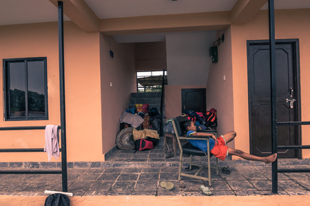 August 27, 2014 - Boy resintg in his new home in Sauraha, Nepalのeditorial素材