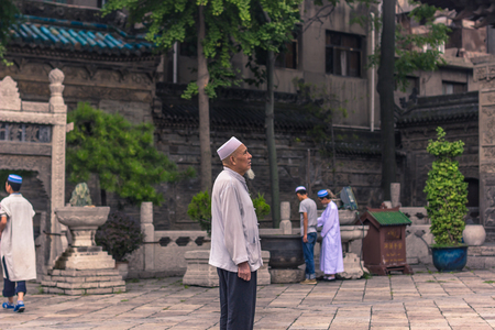 Xi'an, China - July 23, 2014: Old Muslim chinese men at  the Great Mosque of Xi'anのeditorial素材