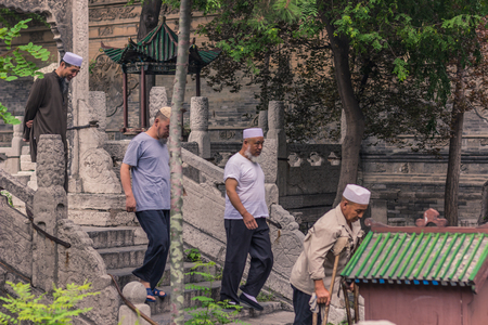 Xi'an, China - July 23, 2014: Old Muslim chinese men at  the Great Mosque of Xi'anのeditorial素材