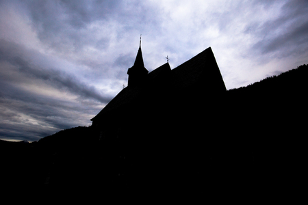 Lomen, Norway - May 13, 2017: Silhouette of the Stave Church of Lomen, Norwayのeditorial素材