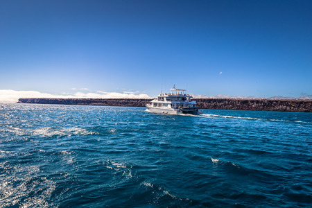 Galapagos Islands - August 24, 2017: Boat near Plaza Sur island, Galapagos Islands, Ecuadorのeditorial素材