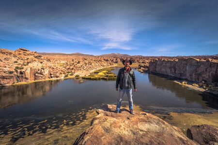 Eduardo Avaroa National Park - July 19, 2017: Traveler in the Black Lagoon in Eduardo Avaroa National Park, Boliviaのeditorial素材