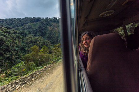 Death Road - July 25, 2017: Tour bus travelling in the Yungas road, or Death Road, Boliviaのeditorial素材