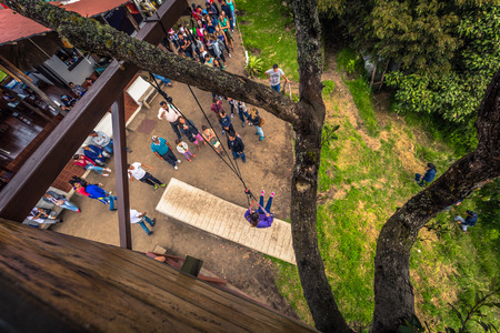 Baños - August 19, 2018: Casa de Arbol swing in Baños, Ecuadorのeditorial素材