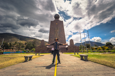 Mitad del Mondo - August 21, 2018: Tourist in the Middle of the World monument in Mitad del Mondo, Ecuadorのeditorial素材