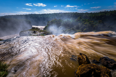Puerto Iguazu - June 24, 2017: Landscape of the Iguazu Waterfalls, Wonder of the world, at Puerto Iguazu, Argentinaの写真素材