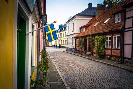 Lund: The Swedish national flag in the historic center of Lund, Swedenの写真素材