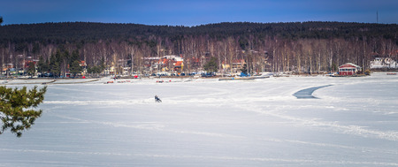 Falun - March 30, 2018: Panorama of the frozen lake at the resort of Framby Udde near the town of Falun in Dalarna, Swedenのeditorial素材