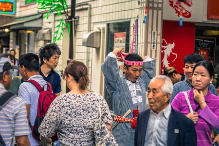 Tokyo - May 19, 2019: People celebrating the Sanja Matsuri festival in traditional clothes in Asakusa, Tokyo, Japanのeditorial素材