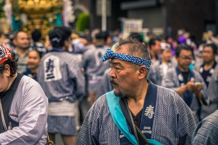 Tokyo - May 19, 2019: People celebrating the Sanja Matsuri festival in traditional clothes in...
