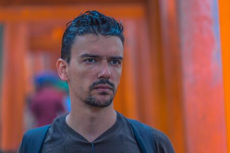 Kyoto - May 28, 2019: Western traveler in the Torii gates of the Fushimi Inari Shinto shrine in Kyoto, Japanのeditorial素材