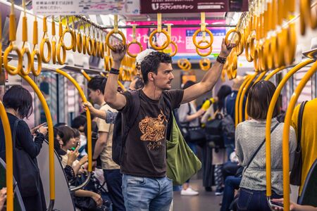 Osaka - June 01, 2019: Western traveler communting in the subway of Osaka, Japanのeditorial素材