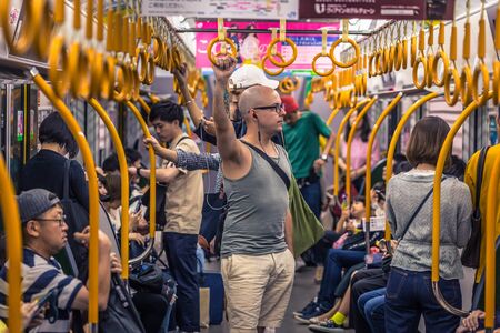 Osaka - June 01, 2019: Western traveler communting in the subway of Osaka, Japan