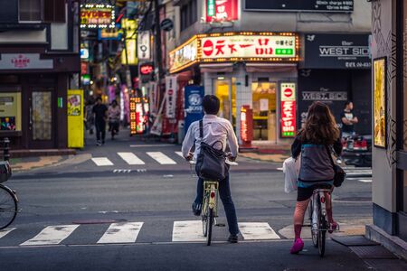 Osaka - June 01, 2019: Japanese people commuting by bike in Osaka, Japan