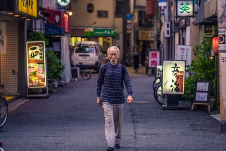 Osaka - June 01, 2019: Old japanese man in the streets of Osaka, Japan