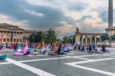 Budapest - June 21, 2019: Yoga event at dawn in Heroes Square in Budapest, Hungaryのeditorial素材