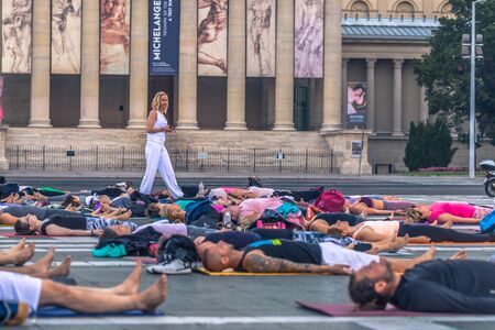 Budapest - June 21, 2019: Yoga event at dawn in Heroes Square in Budapest, Hungaryのeditorial素材