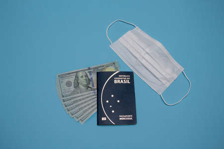 brazilian passport with dollar and mask.の写真素材