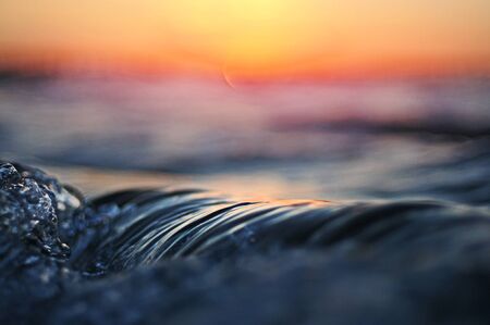 Waves at sunsetの写真素材